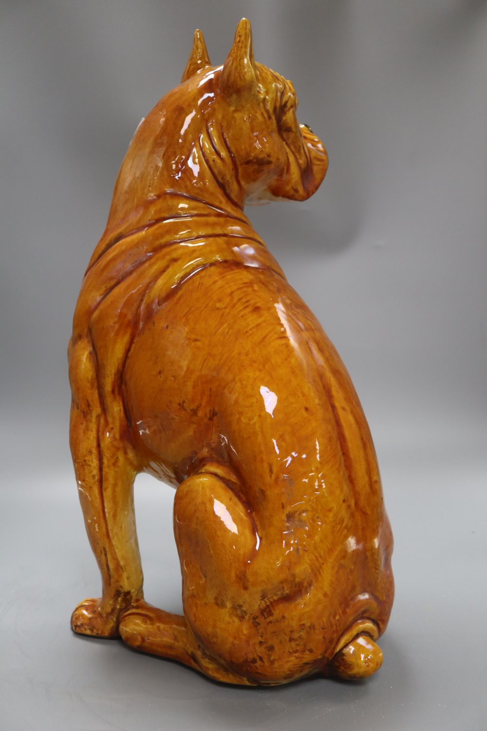 A large tinglaze pottery figure of a boxer dog, height 50cm